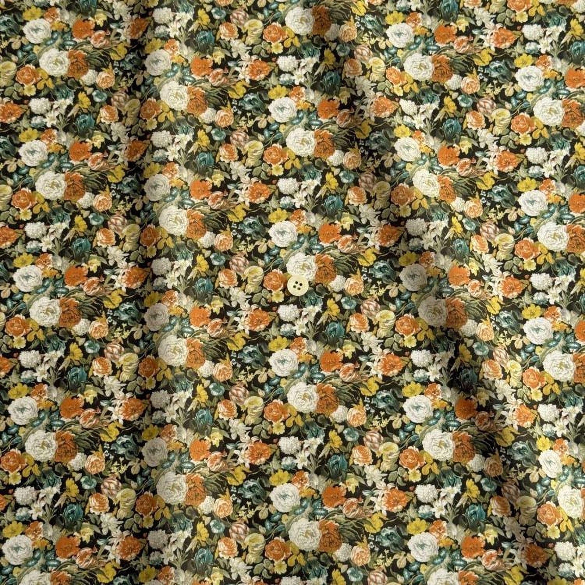 The image is a close-up of a fabric with a floral pattern, featuring a variety of colorful flowers and leaves in shades of orange, yellow, green, and white.