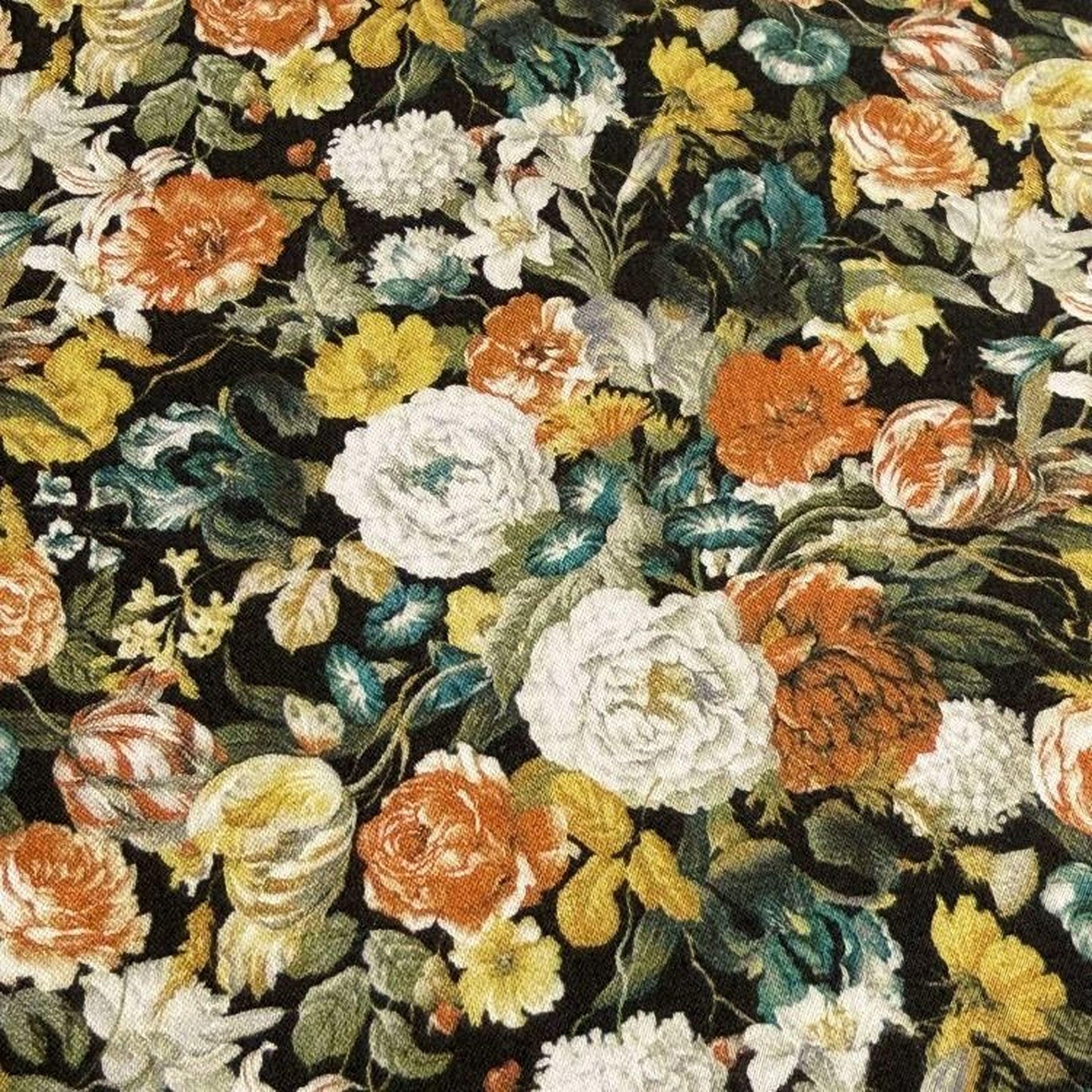 The image is a close-up of a vibrant floral print, featuring a variety of colorful flowers and leaves in shades of orange, white, and yellow against a dark background.
