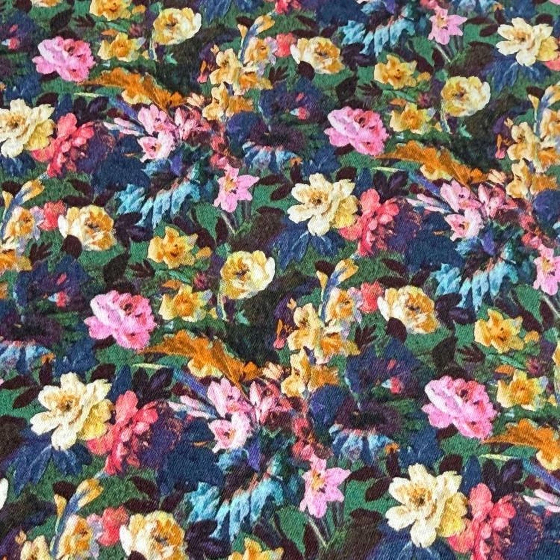The image is a vibrant and colorful floral print, featuring a variety of flowers in shades of pink, yellow, orange, and blue. The flowers are arranged in a visually striking pattern, creating a lively and dynamic composition.