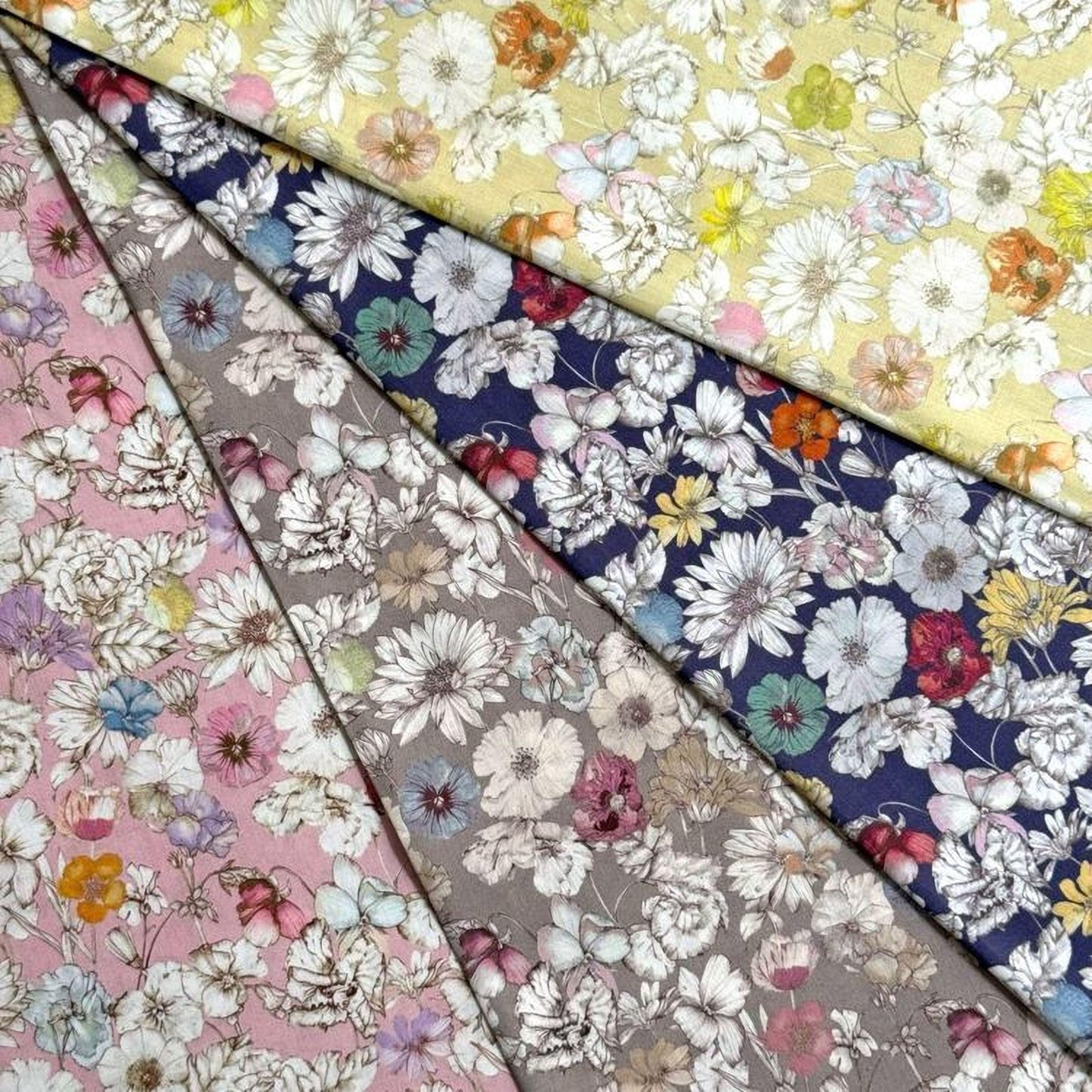 The image is a collage of various colorful floral patterns, including white, pink, blue, and yellow flowers, arranged in a visually appealing manner.