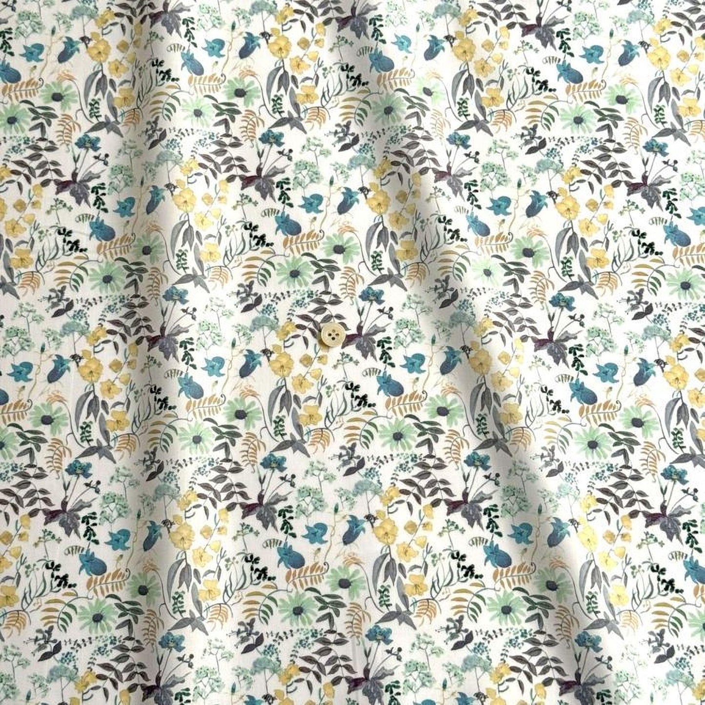 a repeating pattern of various flowers and leaves in shades of green, yellow, and gray. The pattern is composed of different types of flowers and leaves, creating a visually appealing and intricate design.