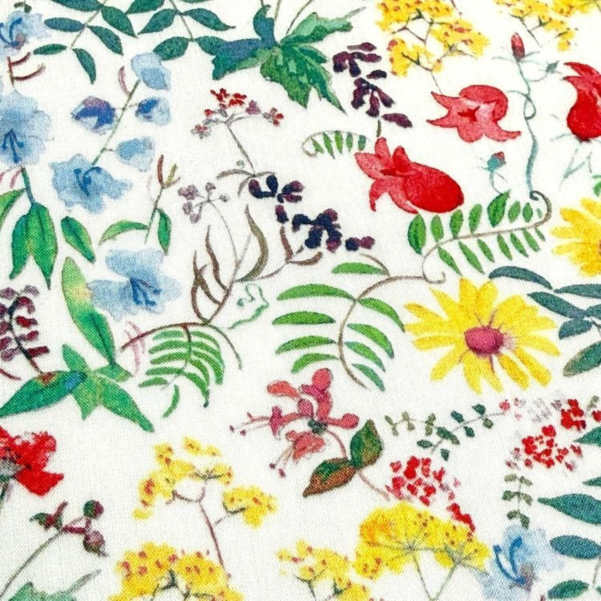 The image is a collage of various colorful flowers and plants, including blue, red, yellow, and green flowers, as well as leaves and other natural elements.