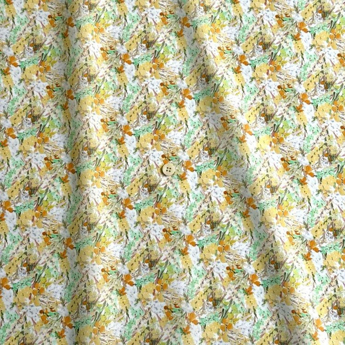 The image is a close-up of a fabric with a repeating pattern of yellow and green flowers, along with some green leaves. The fabric appears to be made of a soft, textured material, and there is a small button visible in the center of the pattern.