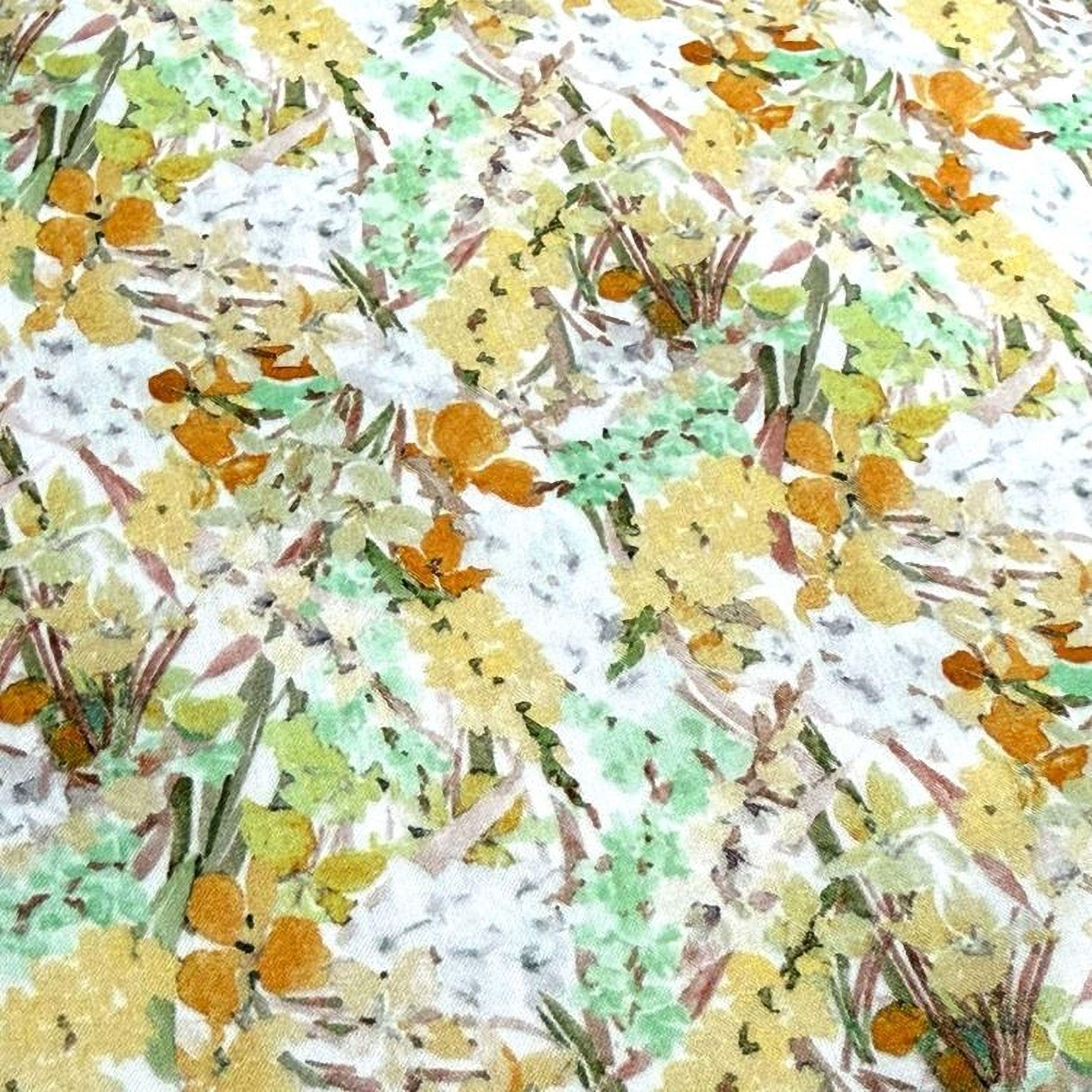 The image is a close-up of a fabric with a floral pattern, featuring a variety of colors including yellow, green, and orange.