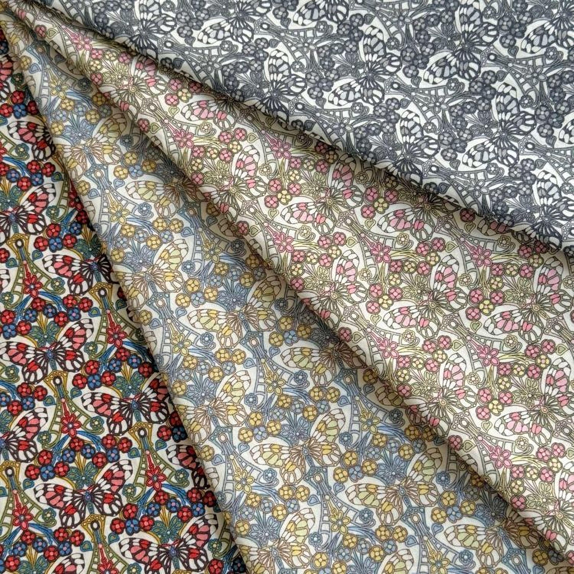 a collection of fabric swatches with various floral and leaf patterns, including a mix of blue, pink, and yellow colors.
