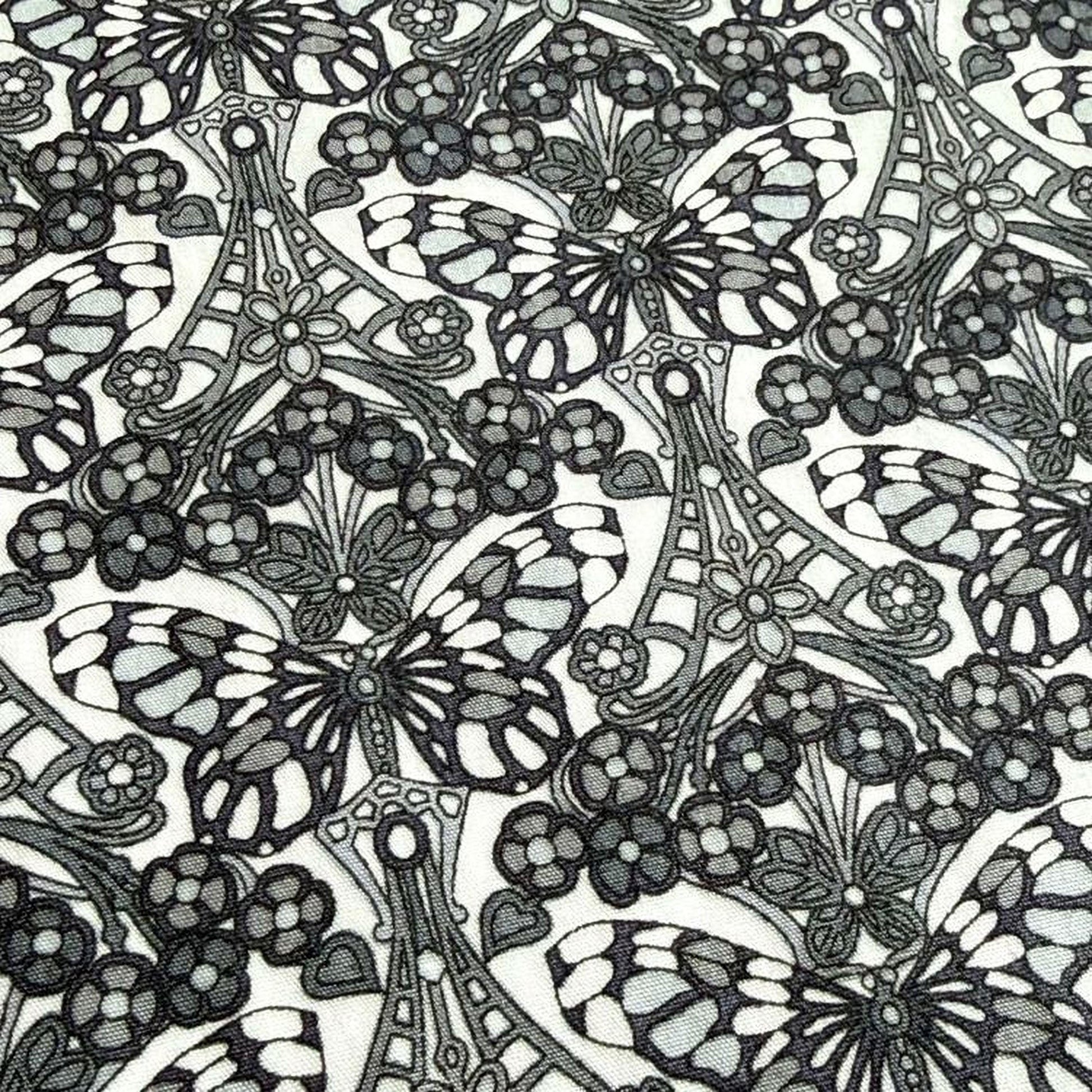 a repeating pattern of black and white butterflies and flowers, creating a visually striking and intricate design.