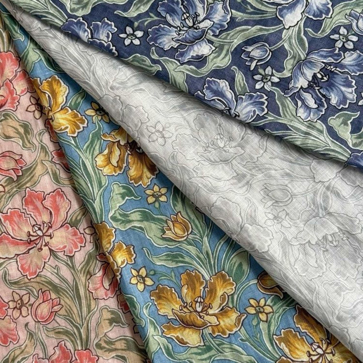 a close-up view of a fabric with a floral pattern, showcasing a variety of colors and designs.