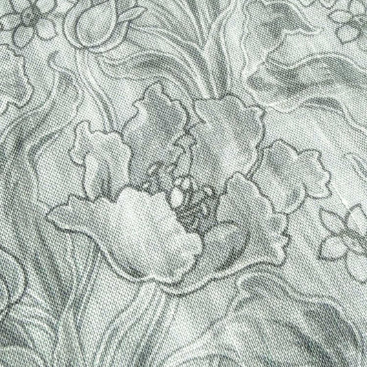 The image is a close-up of a fabric with a floral pattern, featuring a variety of flower shapes and sizes.