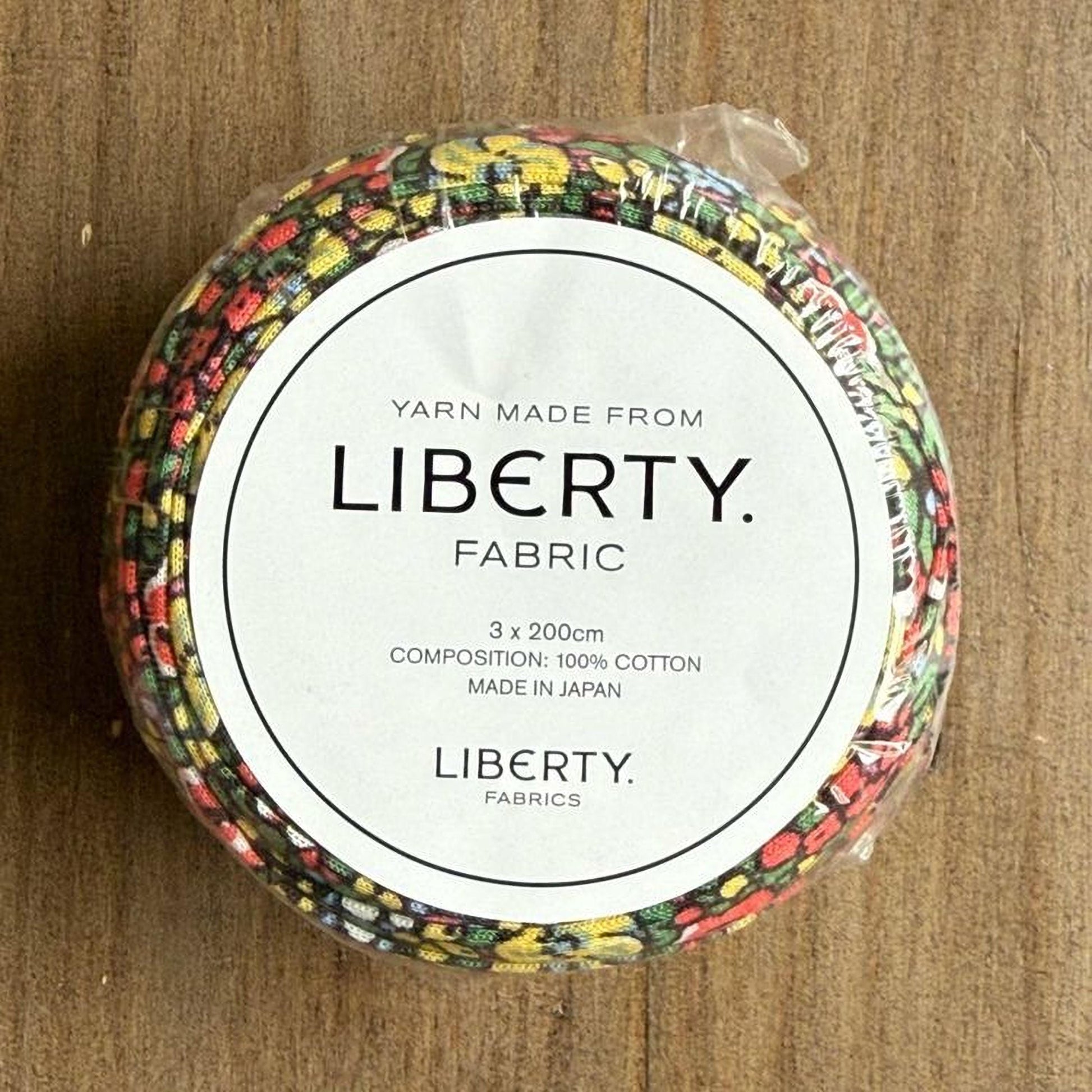 A package of Liberty fabric spools, made from 100% cotton and manufactured in Japan.