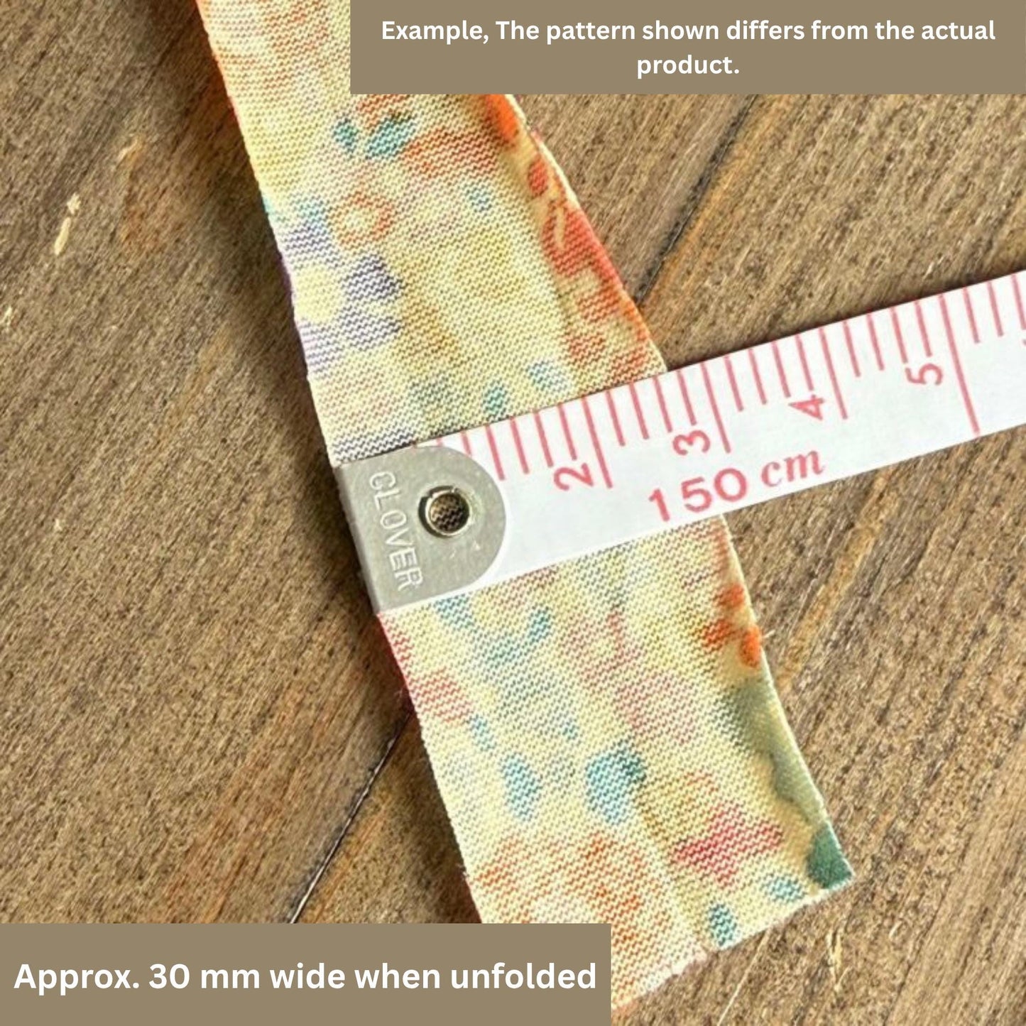 a piece of fabric with a ruler placed on it, indicating the width of the fabric when it is unfurled.