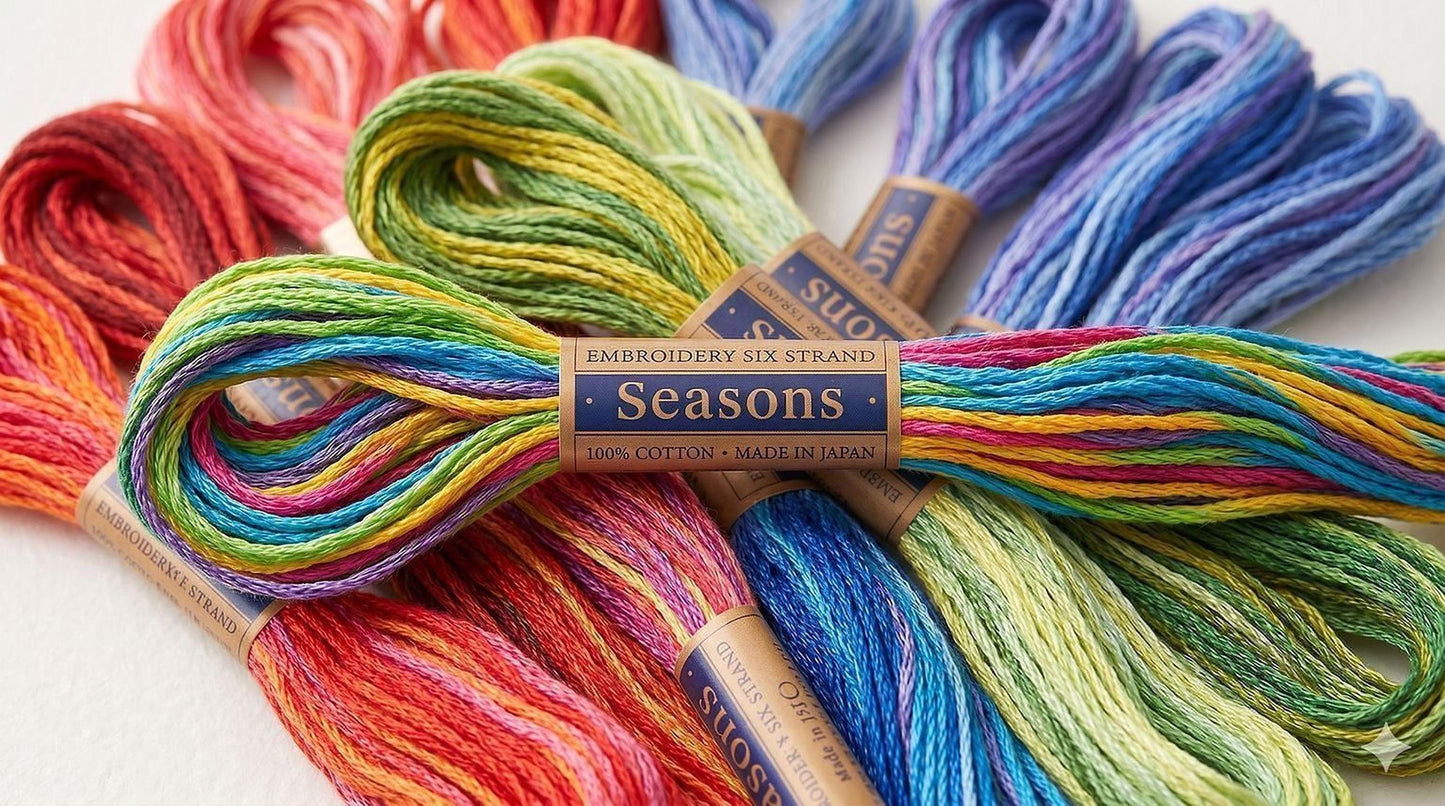 a collection of colorful embroidery strings, including various shades of red, orange, yellow, green, blue, purple, and pink, arranged in a visually appealing manner.