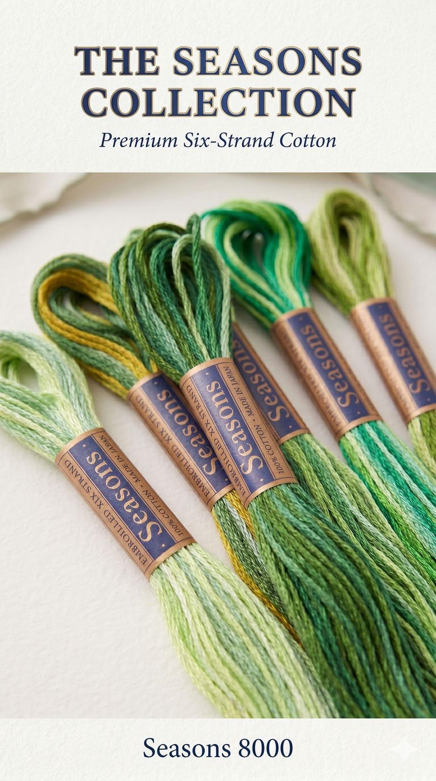 a collection of six spools of thread in various shades of green and yellow, arranged in a row.