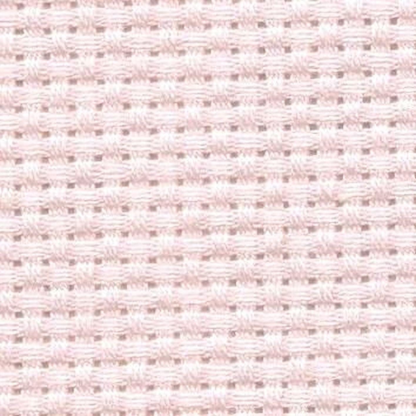 a close-up view of a light pink woven fabric with a grid-like pattern.