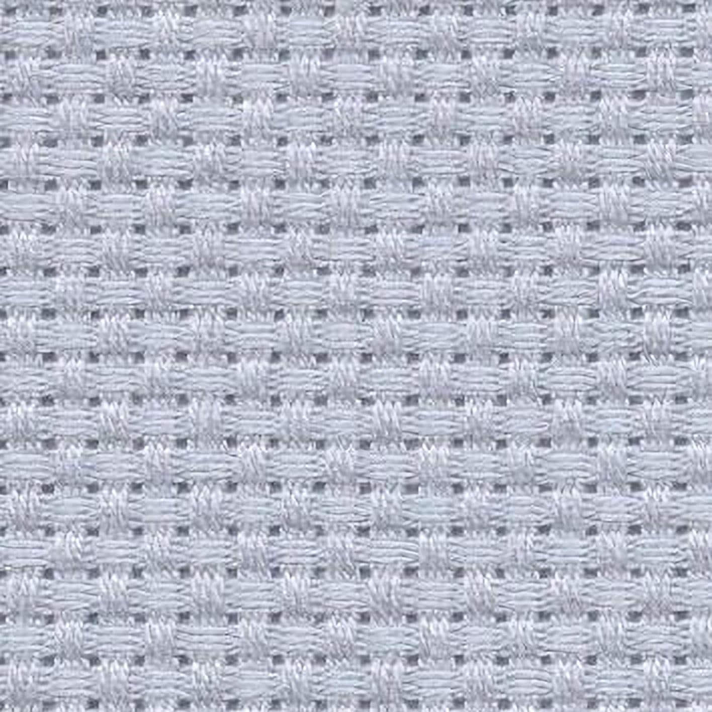 a close-up view of a fabric with a woven pattern, featuring small squares or rectangles arranged in a grid-like pattern.