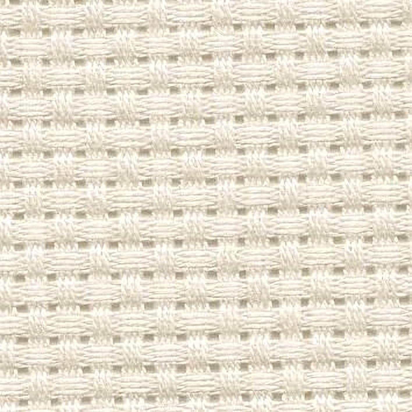 a close-up view of a white woven fabric with a repeating pattern of small squares or rectangles, creating a grid-like texture.