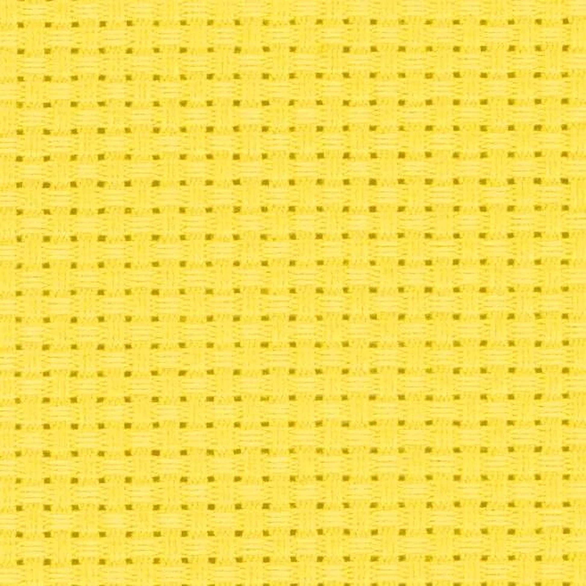 The image is a close-up of a yellow woven fabric with a repeating pattern of small squares or rectangles.