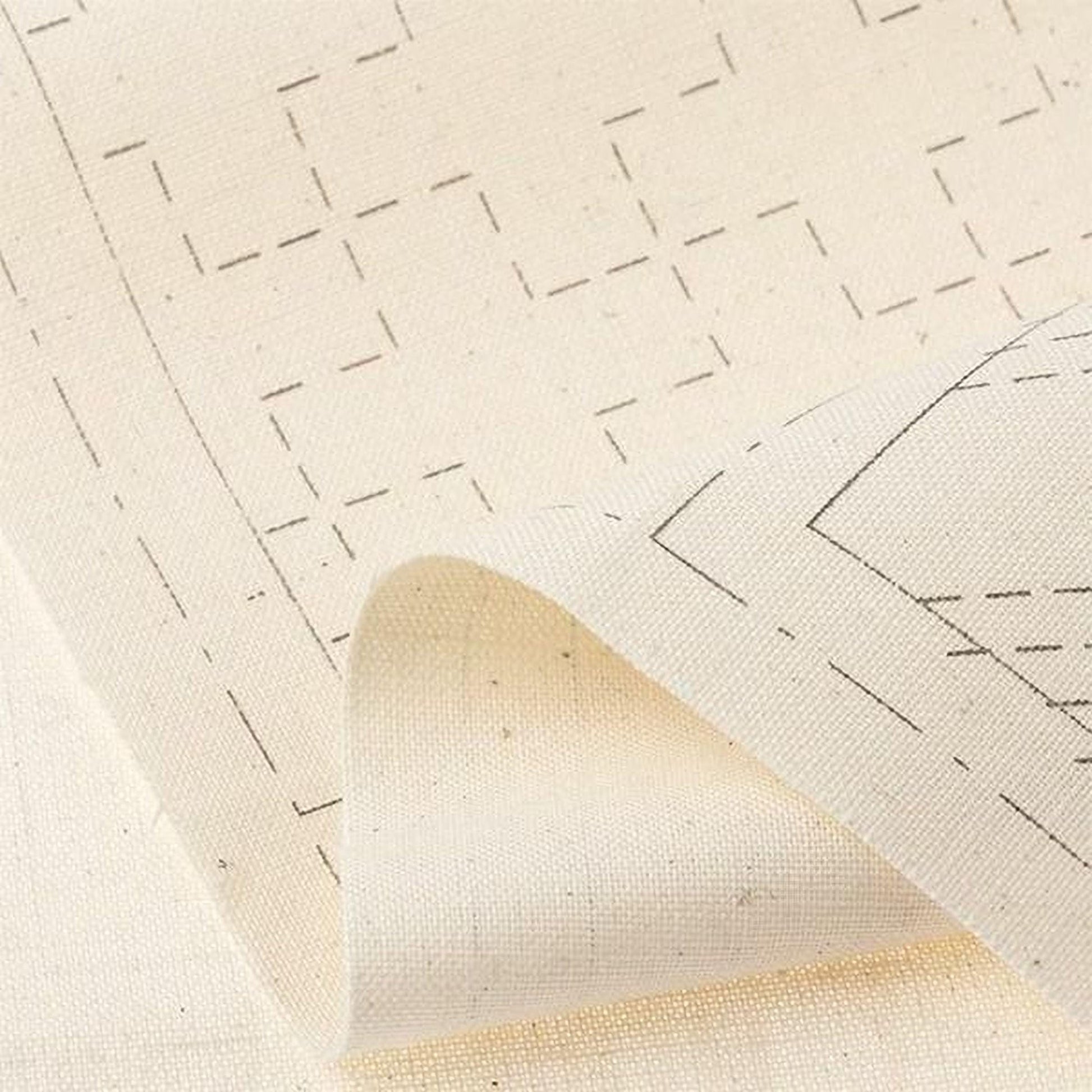 a close-up view of a piece of fabric with a geometric pattern, featuring a mix of black and white lines and shapes.