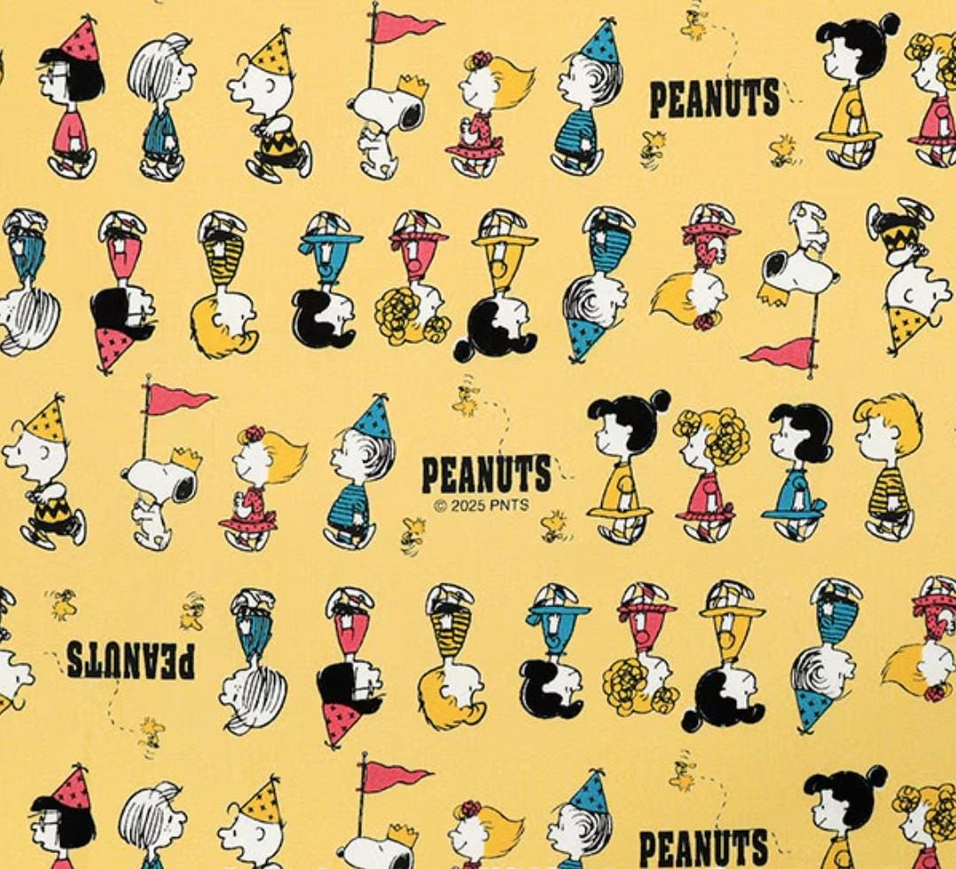 The image is a repeating pattern of various Peanuts characters, including Snoopy, Woodstock, and Charlie Brown, all wearing party hats and engaging in different activities.