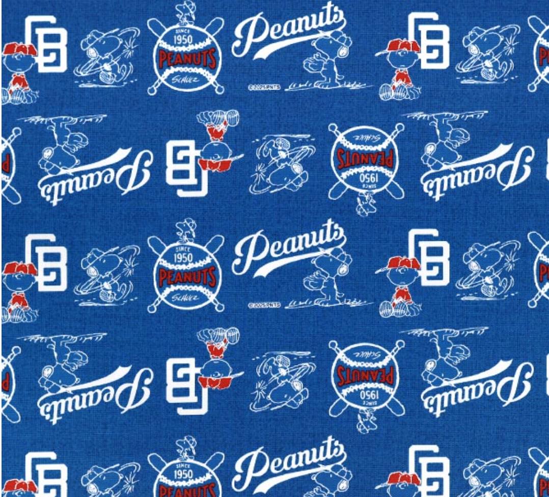 a repeating pattern of various Peanuts baseball-related graphics and text, including the iconic Peanuts logo, baseball bats, and baseball gloves, all set against a blue background.