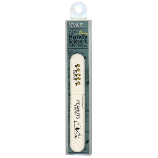 A Peanuts-branded nail file with a cartoon image of Snoopy on it, designed for use with the Peanuts brand.