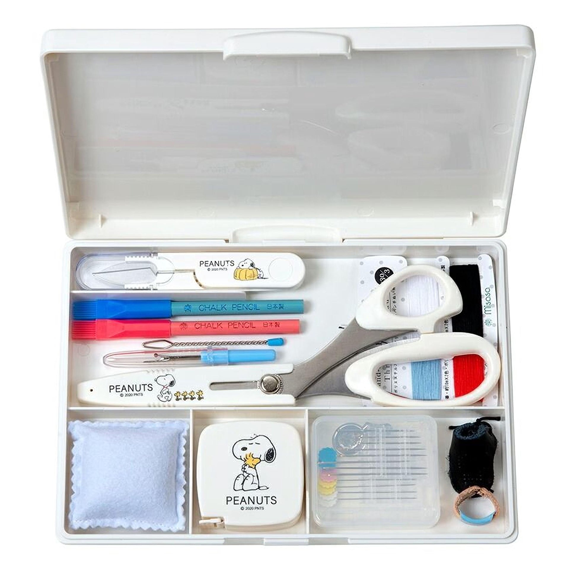 A white plastic box containing various office and craft supplies, including a pair of scissors, a pencil, a pen, and other tools.