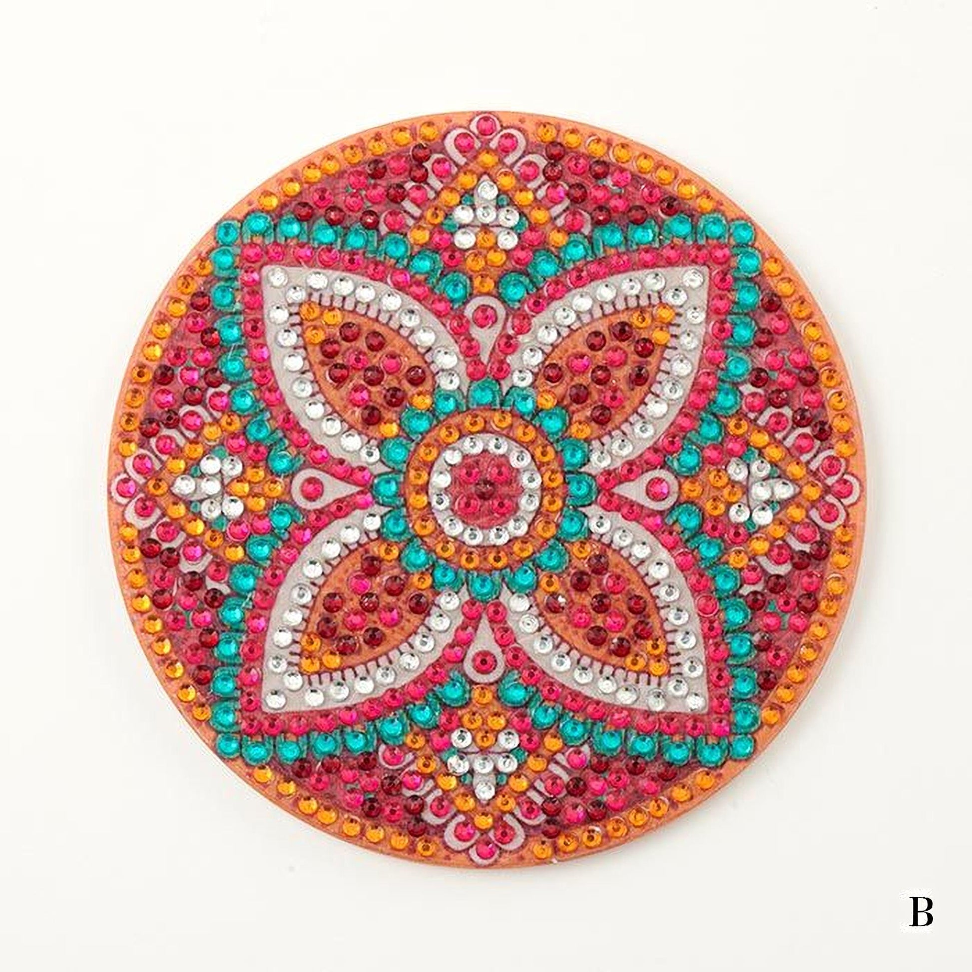 a circular, ornate piece of jewelry or decoration with a vibrant, colorful design. The design is composed of various shapes, including flowers and geometric patterns, and is adorned with numerous small, colorful beads or stones. The overall appearance of the piece is visually striking and eye-catching.