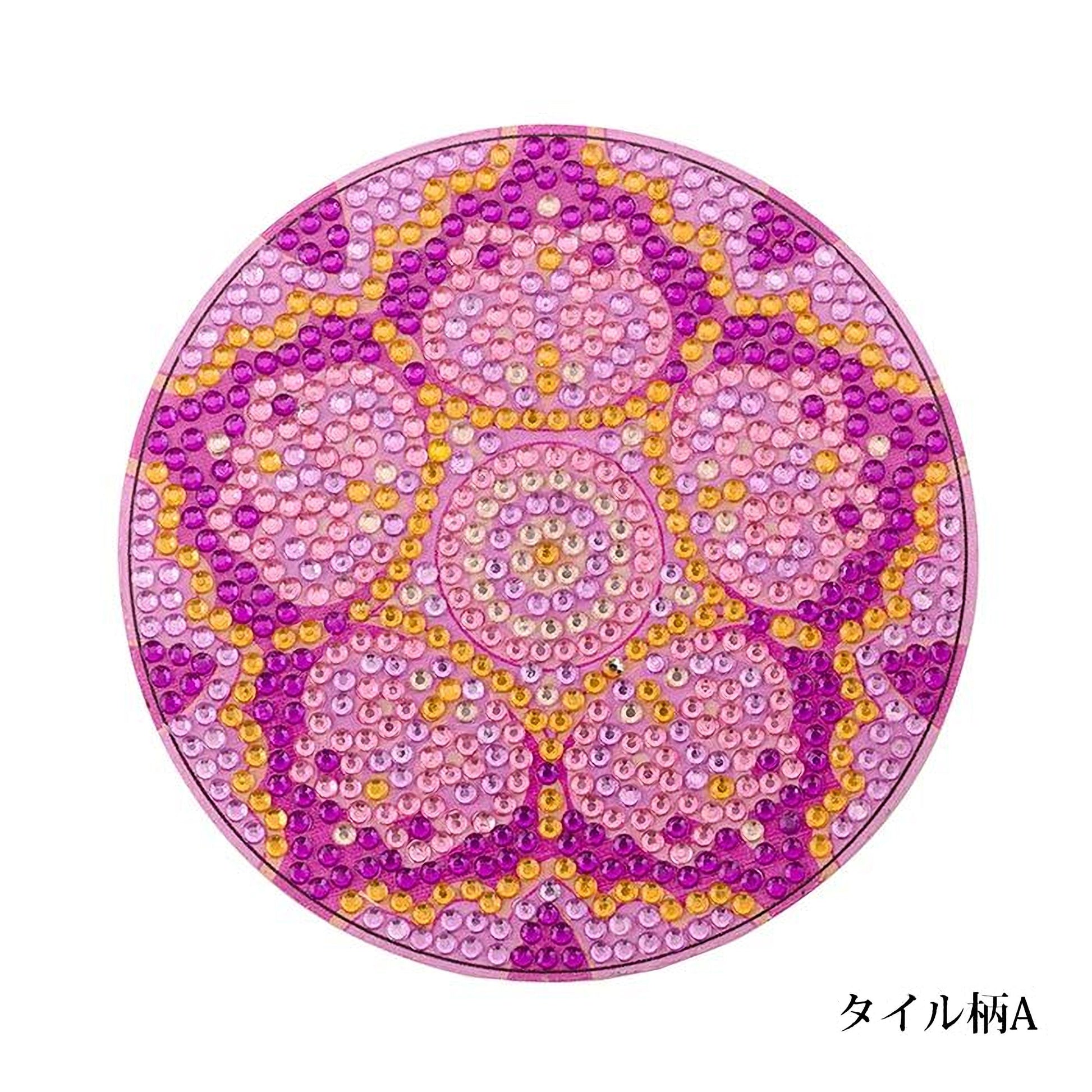 A circular design composed of numerous small, colorful beads in shades of pink, yellow, and purple.