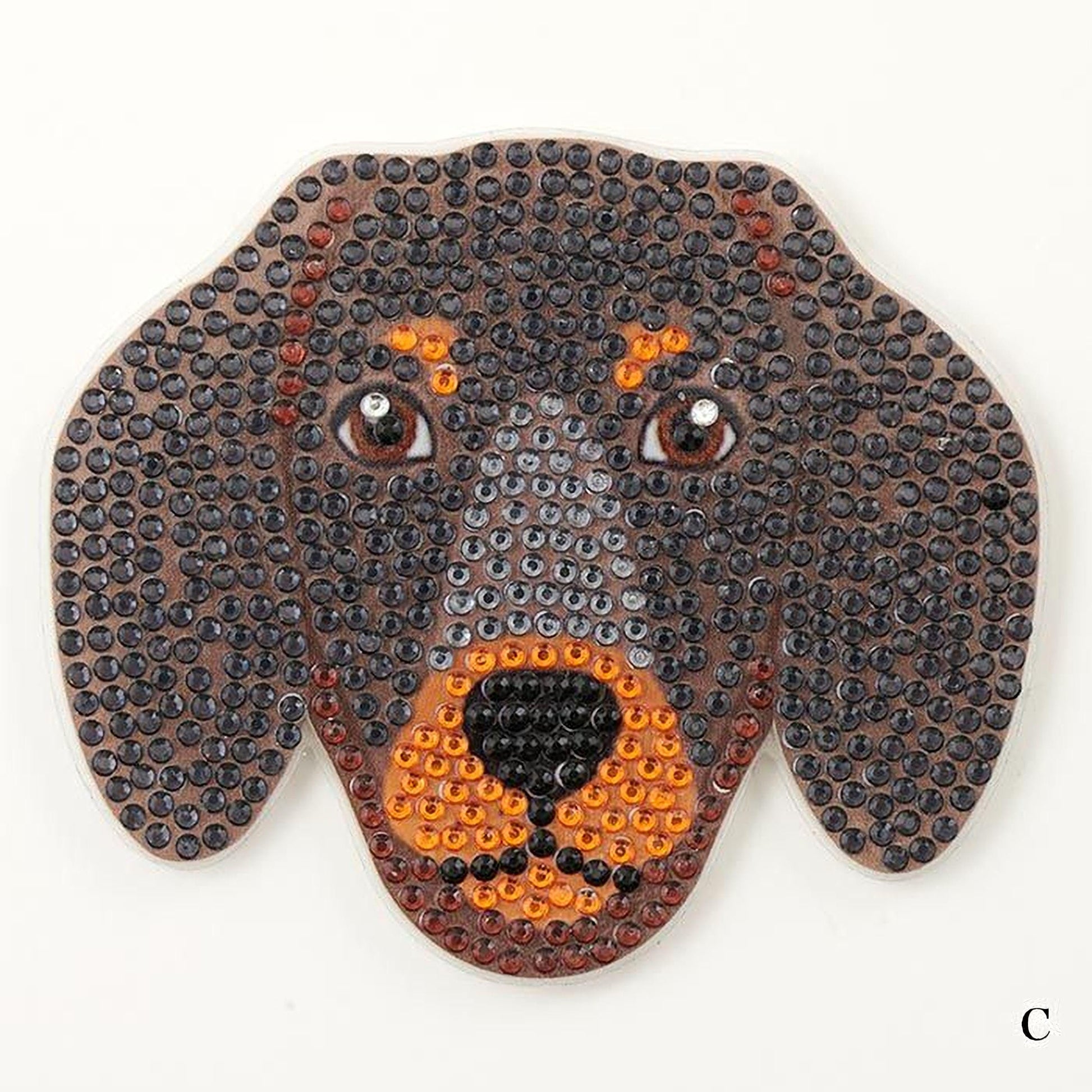 A close-up of a dog's head made up of small, colorful beads or buttons arranged in a pattern.