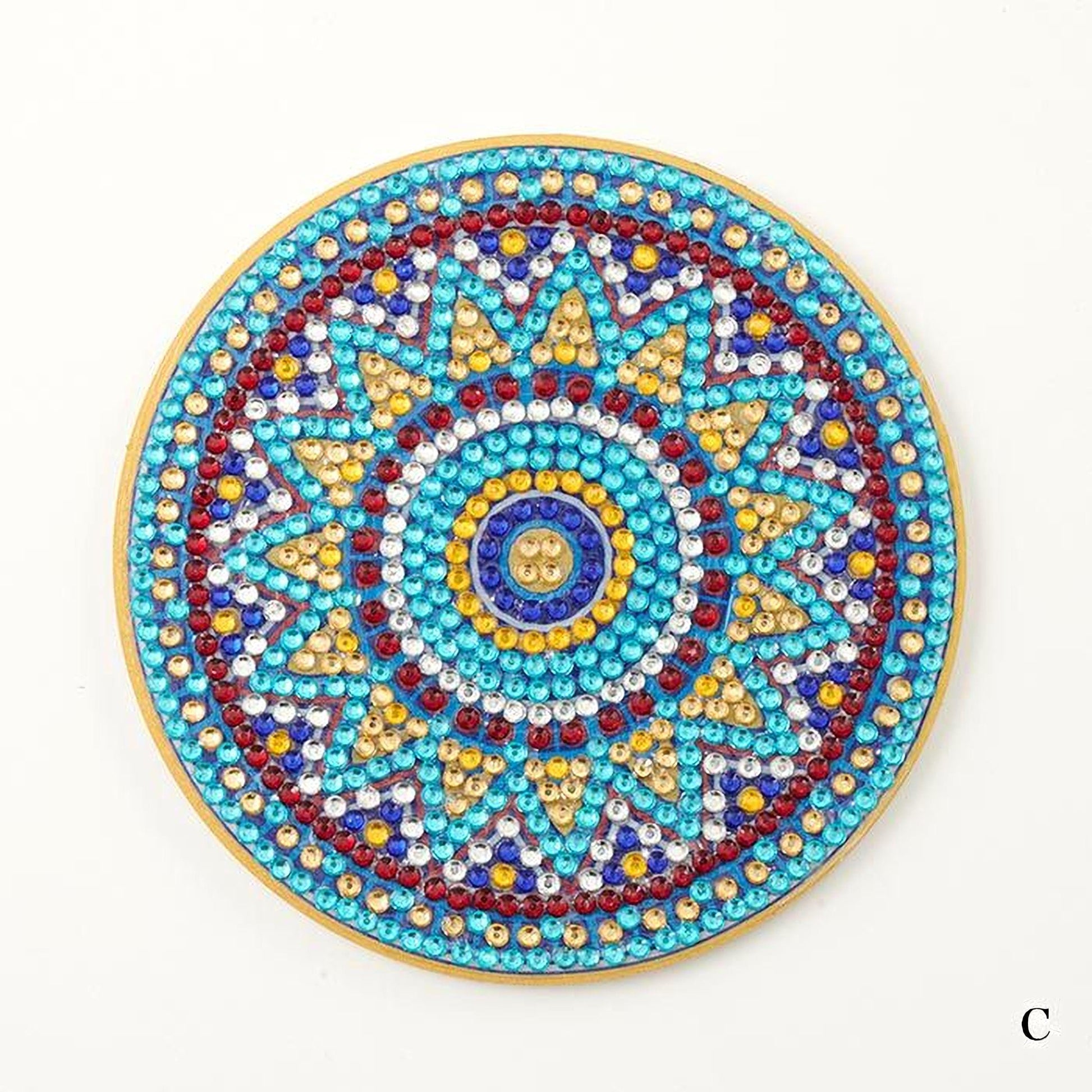 A colorful, intricate design featuring a central motif surrounded by a border of various colored beads and stones.