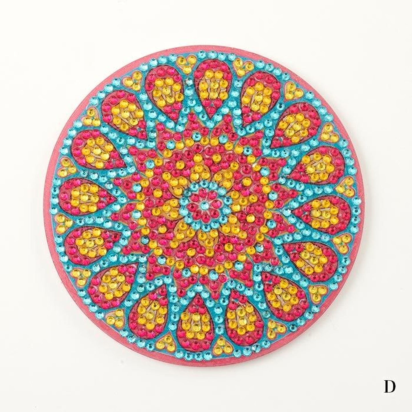 A colorful, circular coaster with a vibrant, intricate design featuring a central motif surrounded by a pattern of overlapping shapes in various colors, including pink, yellow, blue, and green.