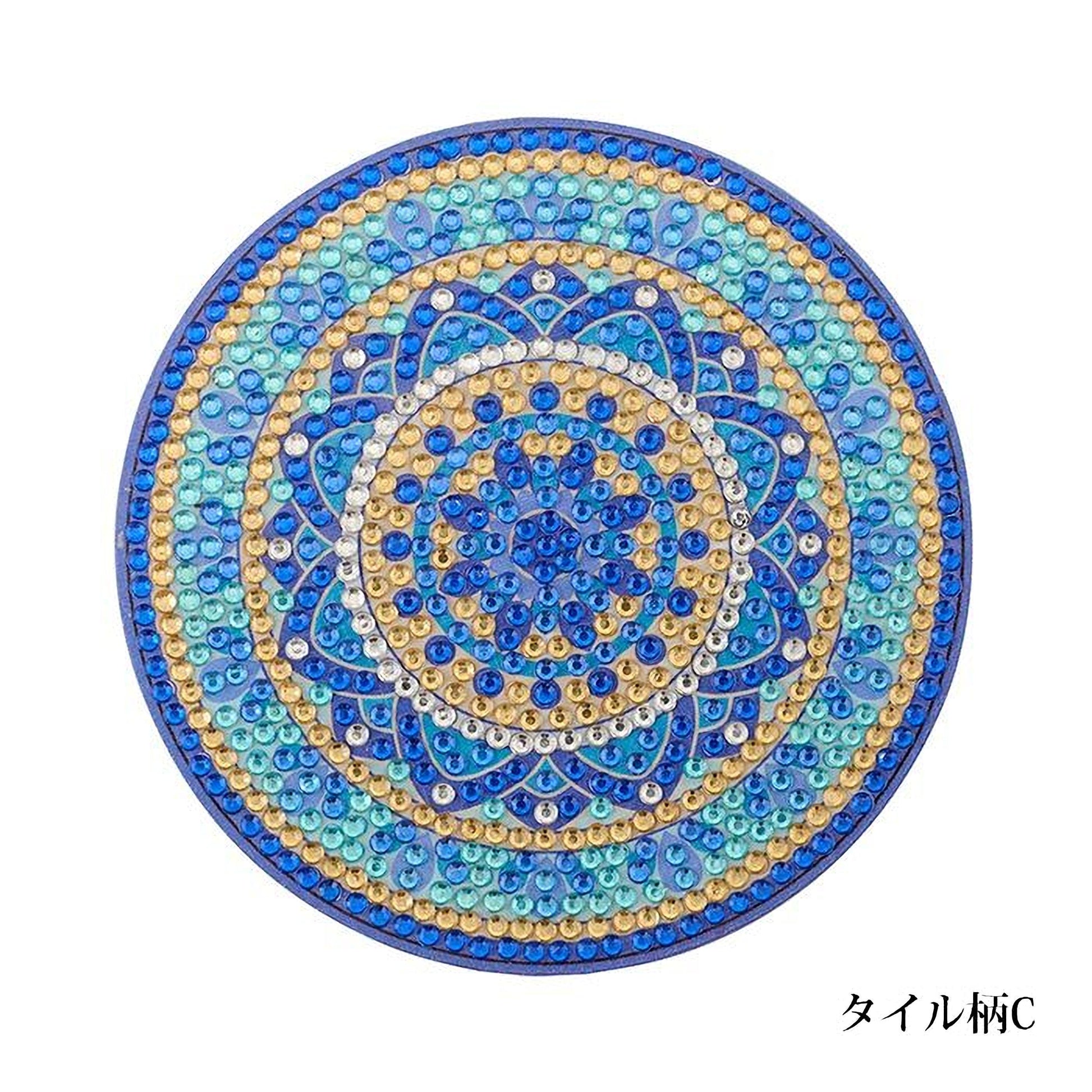 A circular design with a blue and gold pattern, featuring a central blue flower surrounded by smaller blue and gold circles.