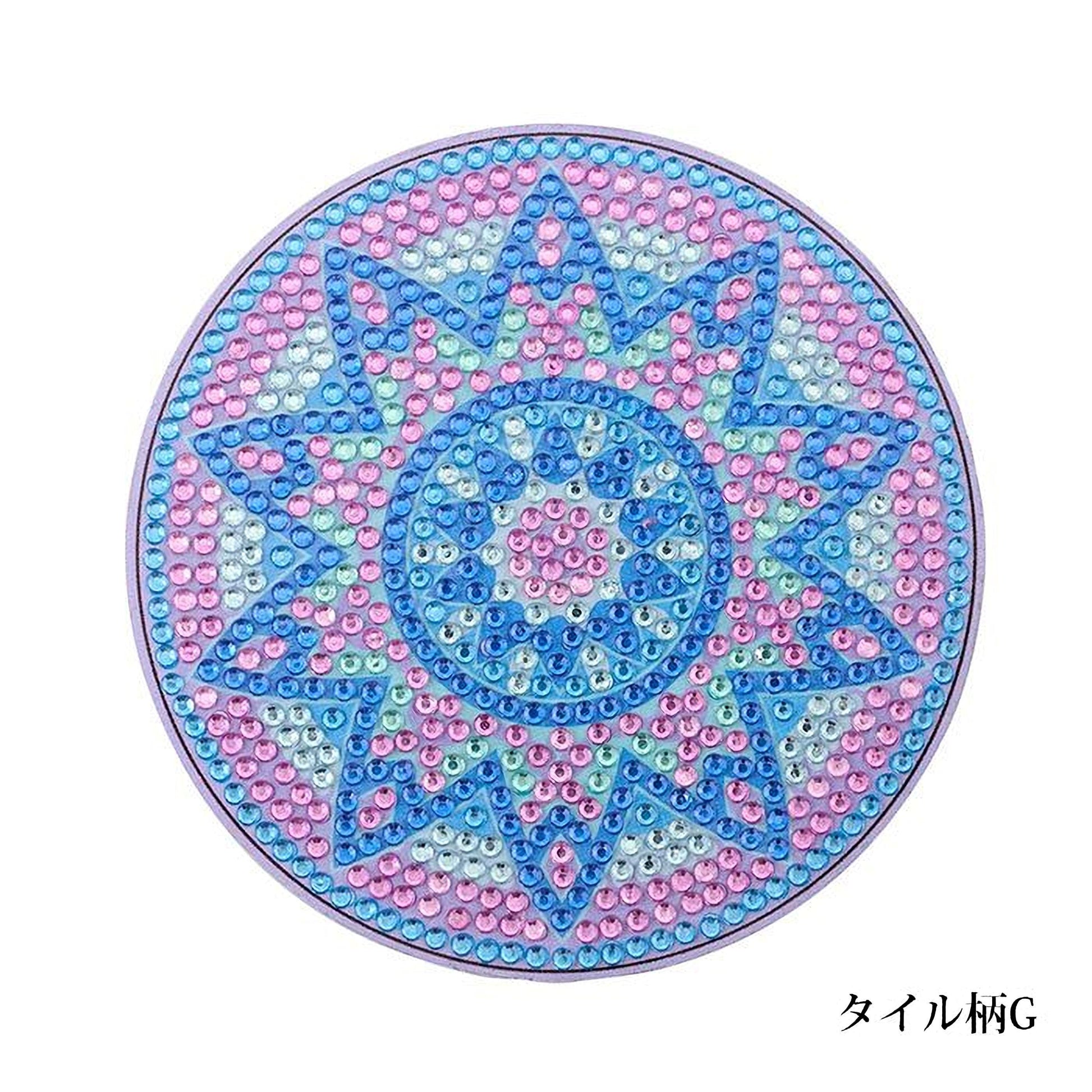 A circular design with a pattern of blue and pink diamonds, resembling a sun or star shape.