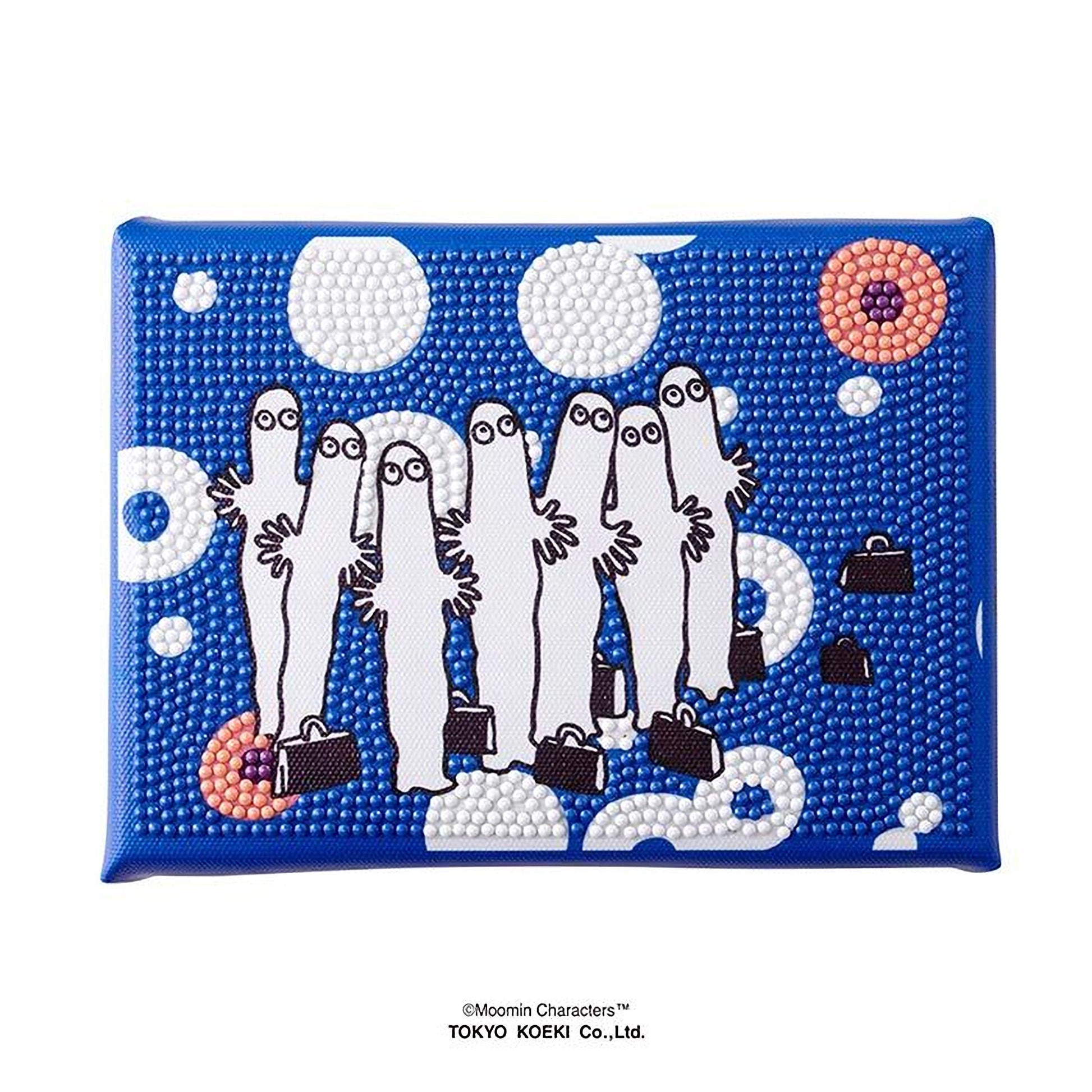 A blue and white patterned wallet or card with a group of cartoon-like figures, including a character with a suitcase, set against a background of polka dots and circles.