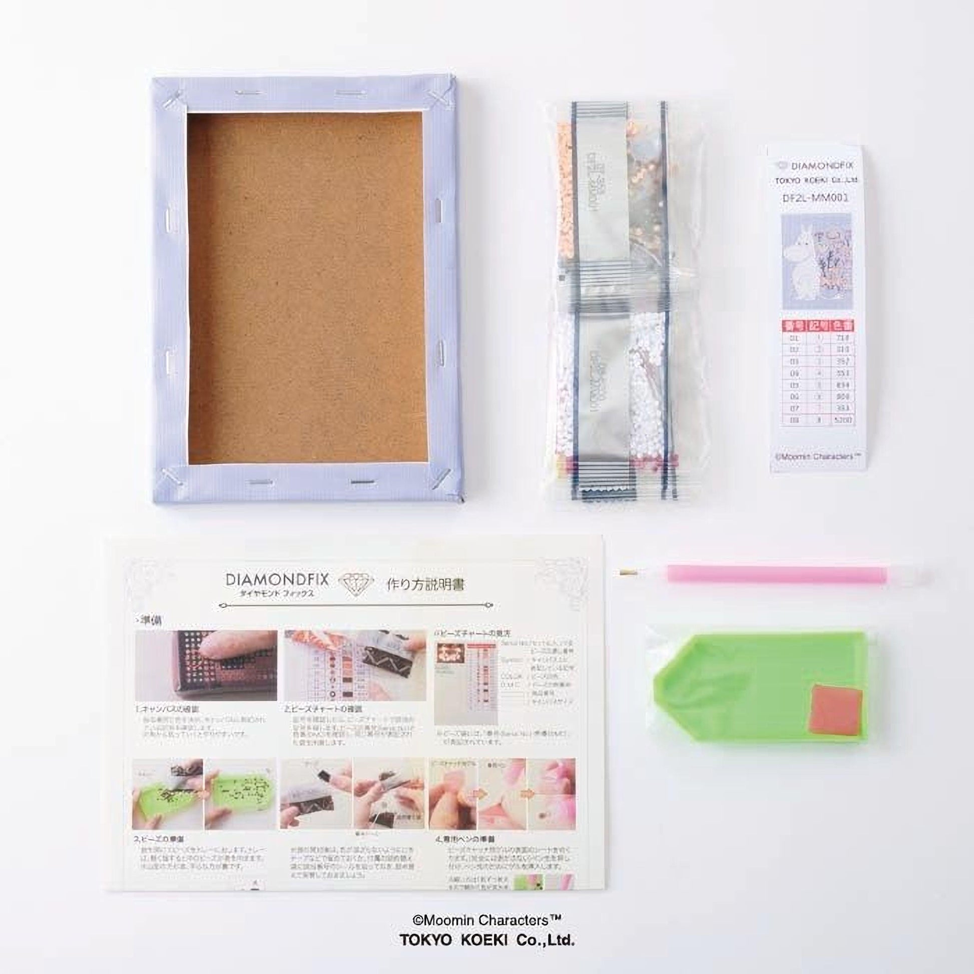 various items related to diamond crafting, including a blank canvas, a diamond box, diamond tools, and instructions.