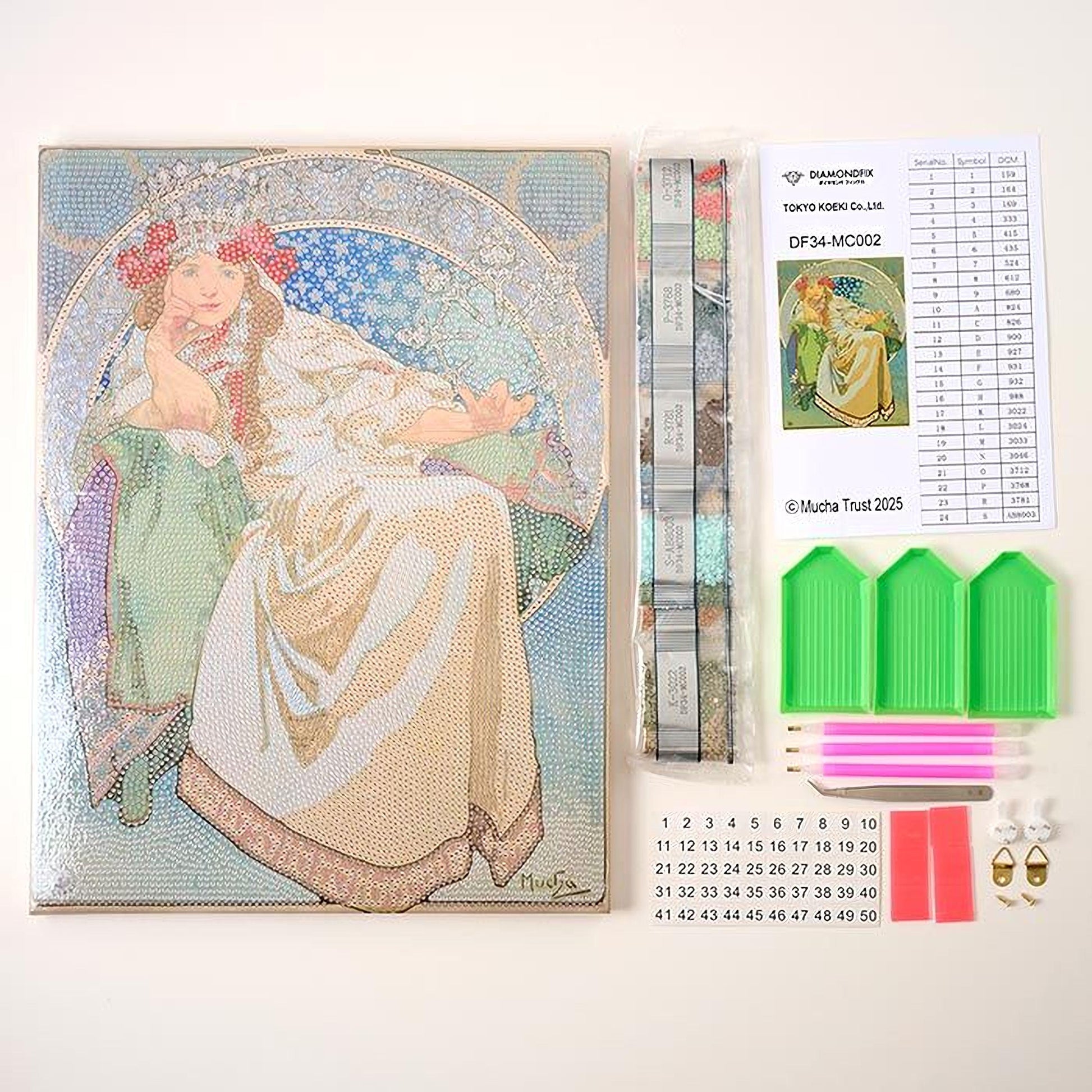 a diamond-encrusted book, a diamond-encrusted kit, and a diamond-encrusted kit with a grid, all arranged on a white surface.