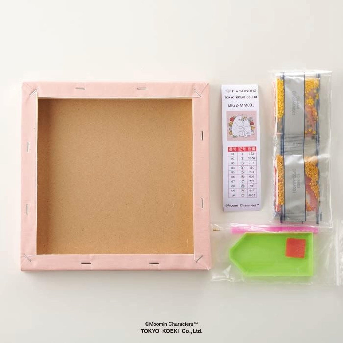 a blank canvas frame, a set of diamond-like embellishments, and a diamond-like embellishment kit.