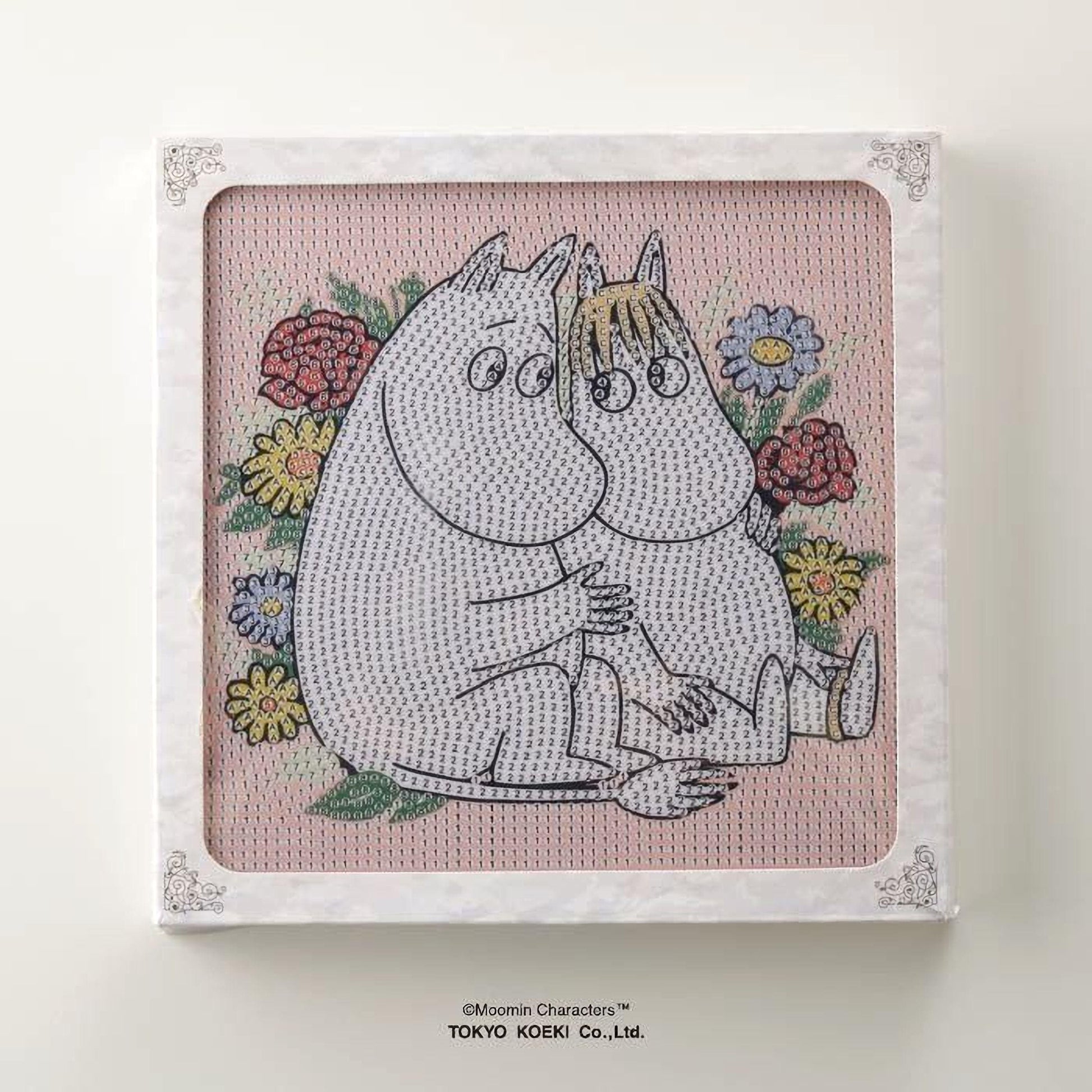 a square frame with a cartoon-like illustration of two anthropomorphic animals, possibly Moom and Minnie Mouse, sitting together and surrounded by flowers.