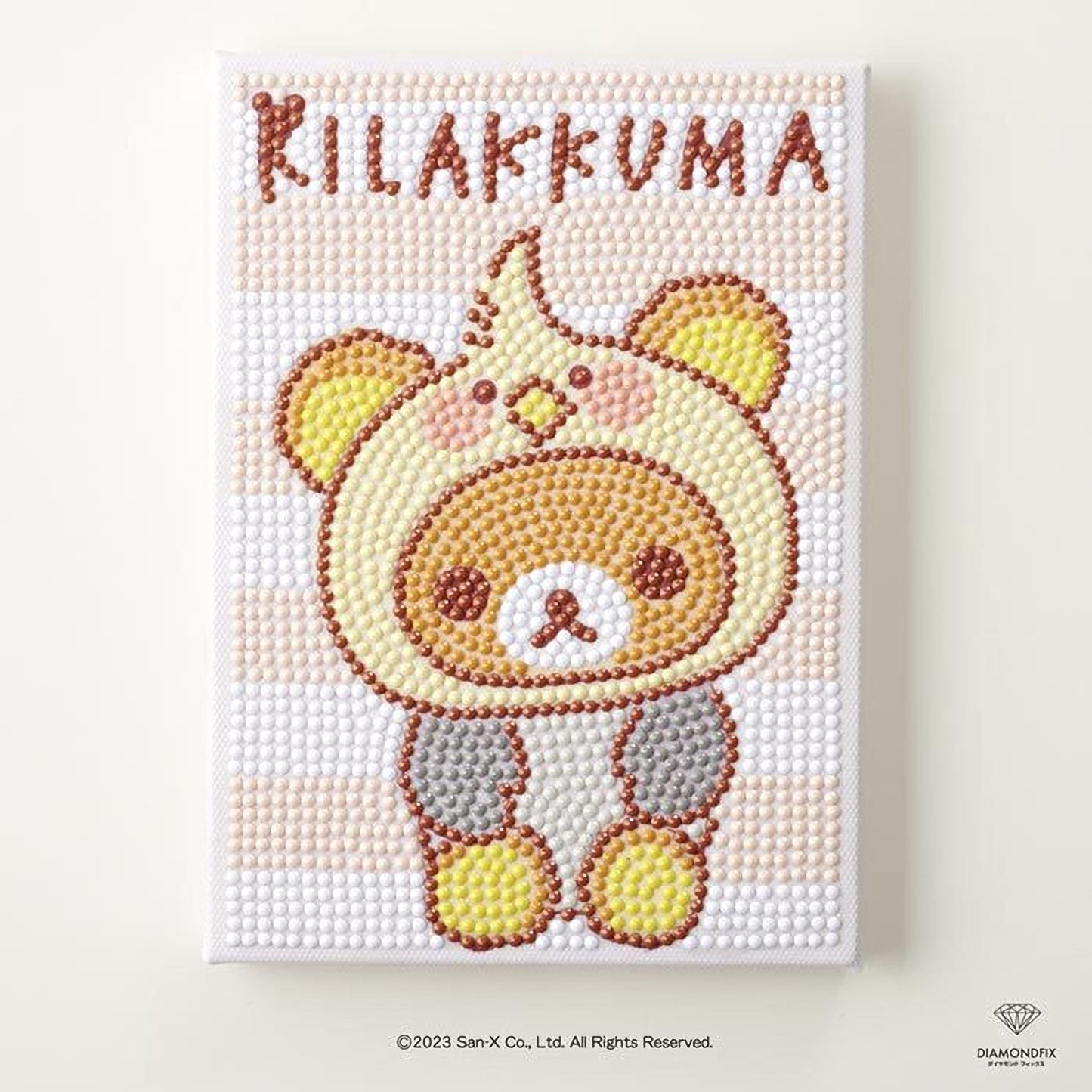 A collage of images depicting a bear wearing a costume, with the text "Kilakuma" written above the bear.