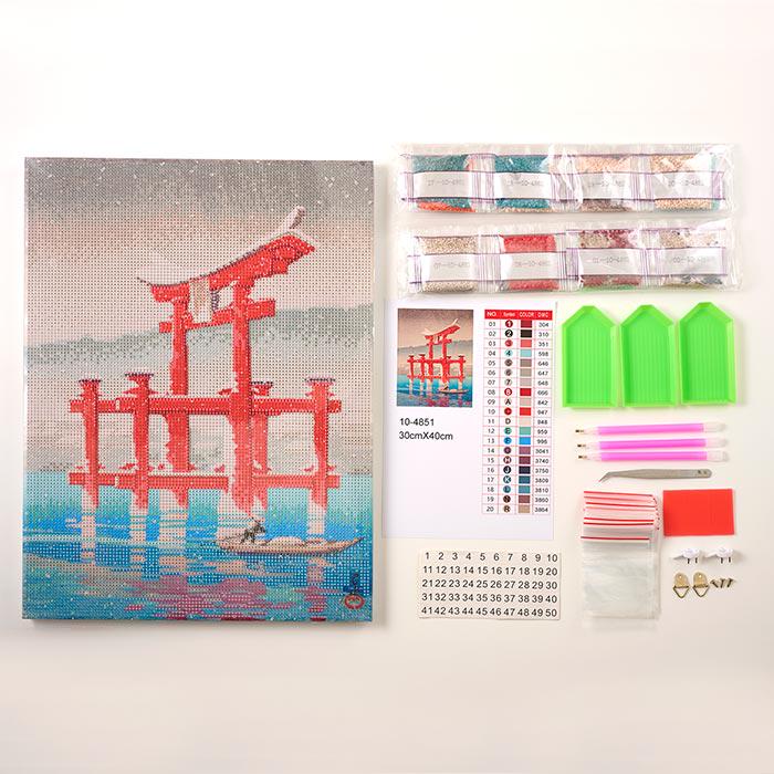 a kit for creating a diamond-like artwork, including a kit with tools, a kit with materials, and a kit with instructions. The kit appears to be designed for creating a painting of a red torii gate over water.