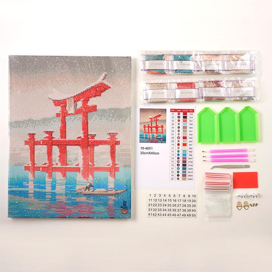 a kit for creating a diamond-like artwork, including a kit with tools, a kit with materials, and a kit with instructions. The kit appears to be designed for creating a painting of a red torii gate over water.