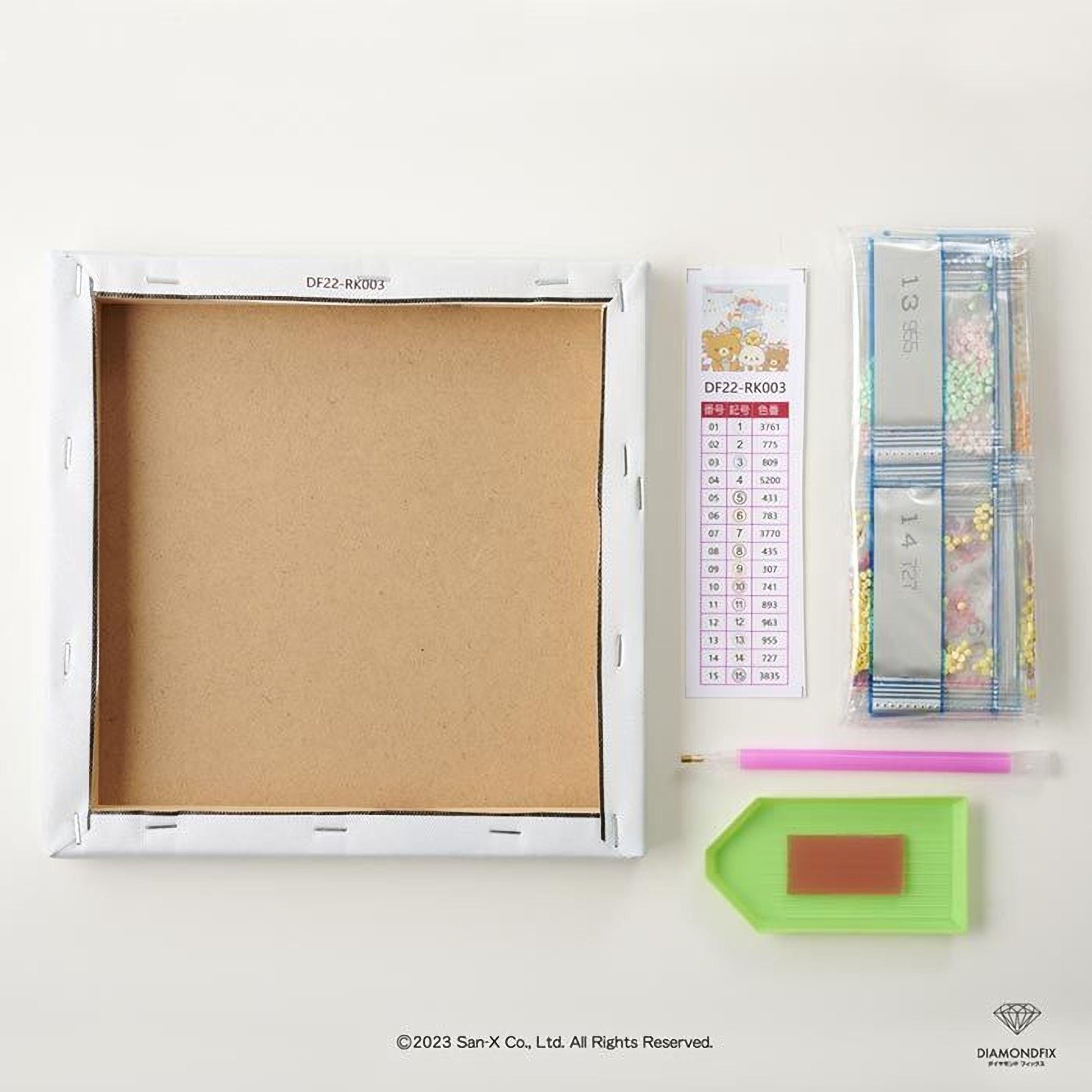 a blank canvas, a diamond-encrusted box, a diamond-encrusted pen, a diamond-encrusted pencil, and a diamond-encrusted magnifying glass, all arranged on a white surface.
