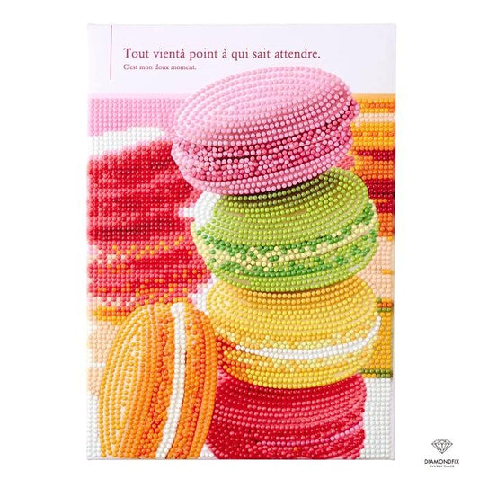 The image is a colorful and vibrant collection of various pastel-colored macarons, each with different shapes and sizes, arranged in a visually appealing manner.
