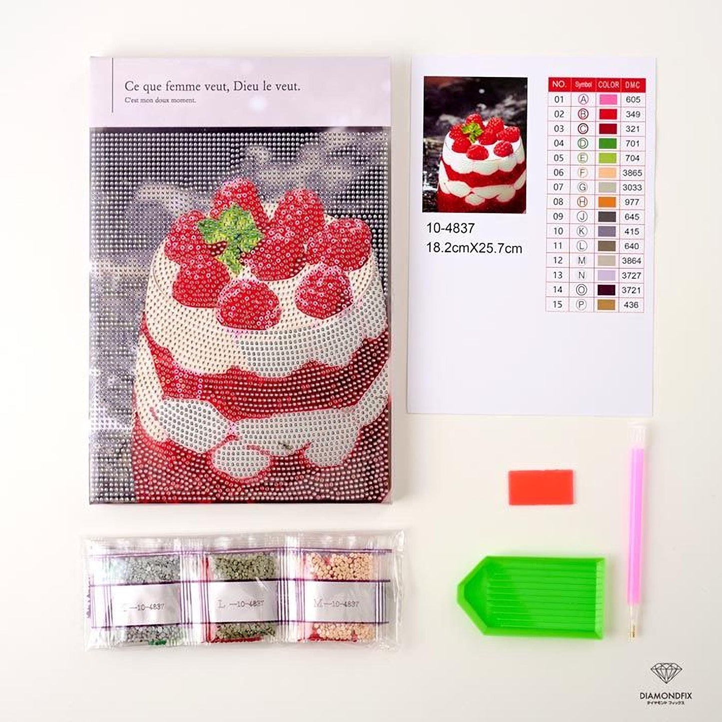 various items related to a DIY project, including a diamond-encrusted cake, a book, a recipe, a kit, and some tools.