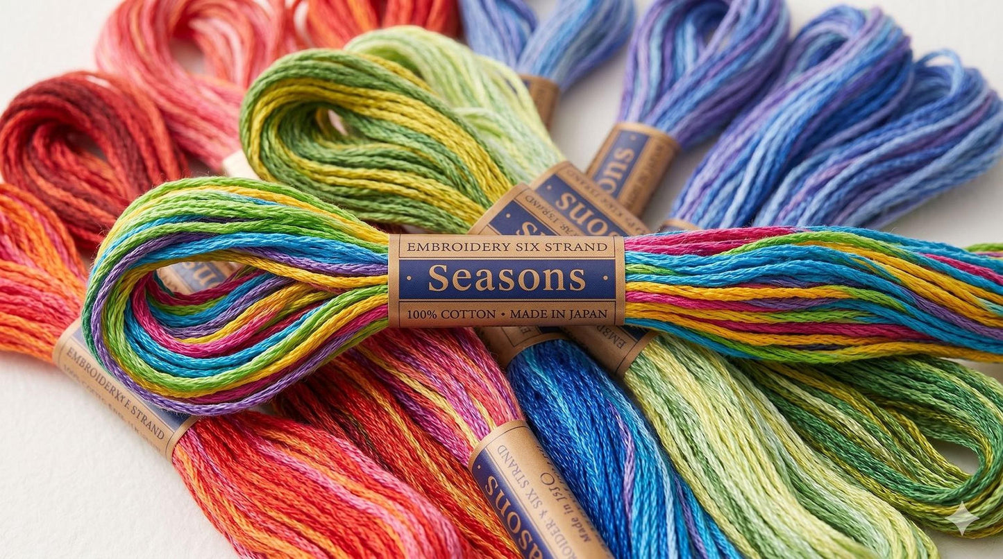 a collection of colorful embroidery strings, including various shades of red, orange, yellow, green, blue, purple, and pink, arranged in a visually appealing manner.