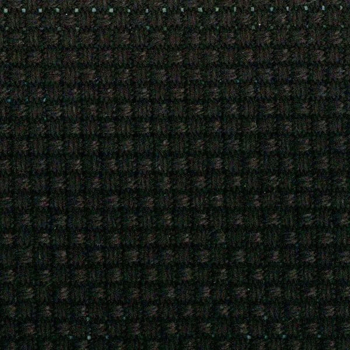 The image is a close-up of a dark, textured fabric with a grid-like pattern.