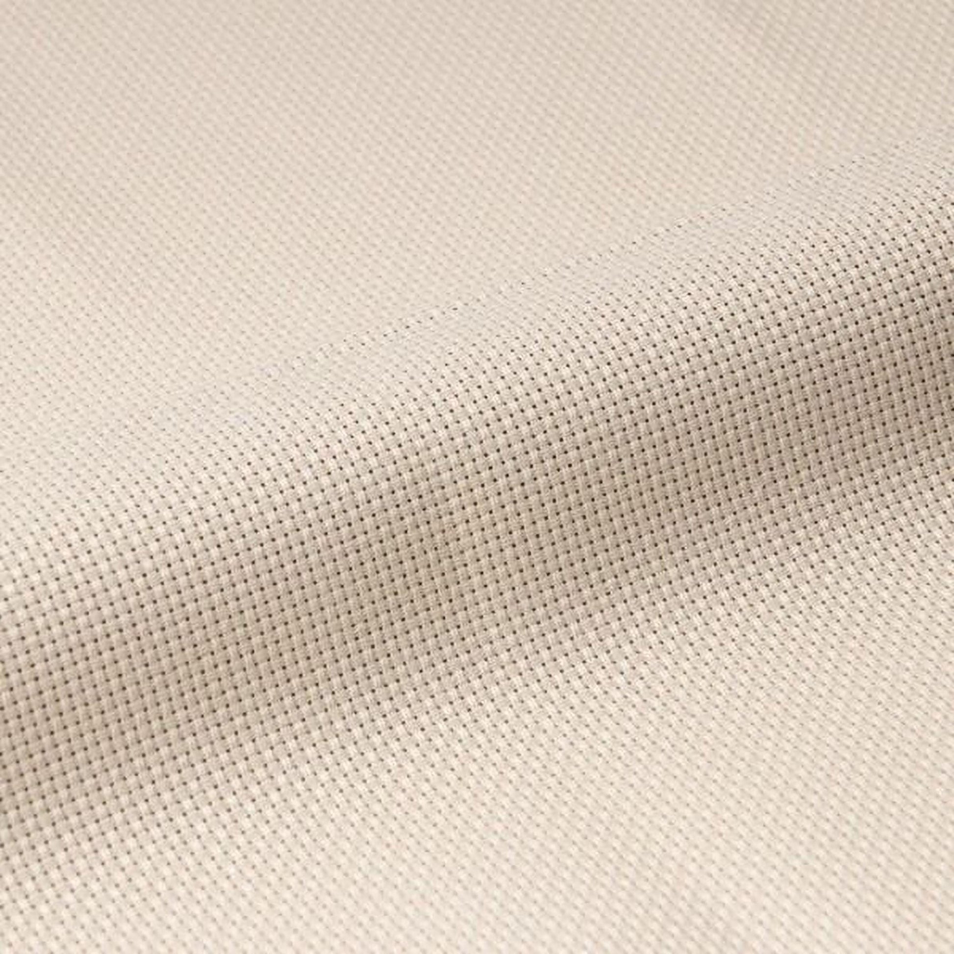 A close-up image of a fabric with a criss-cross pattern, featuring small white dots arranged in a diagonal pattern.