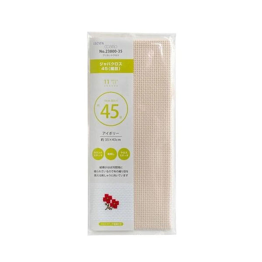 a package of a product with a white background and a green label. The product is a white mesh with a floral design.
