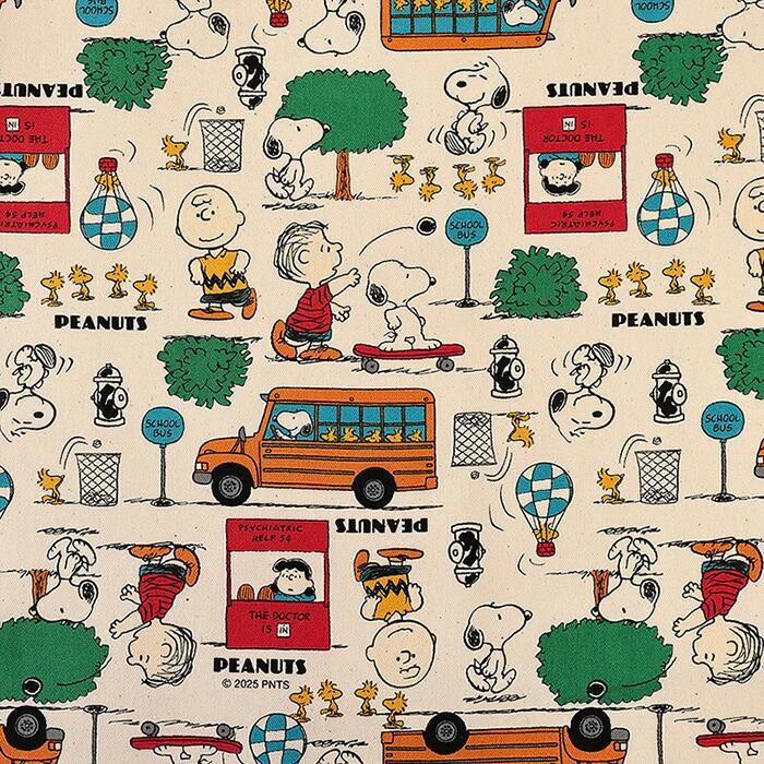 The image is a repeating pattern featuring various Peanuts characters and objects, such as a school bus, a tree, and a hot air balloon.
