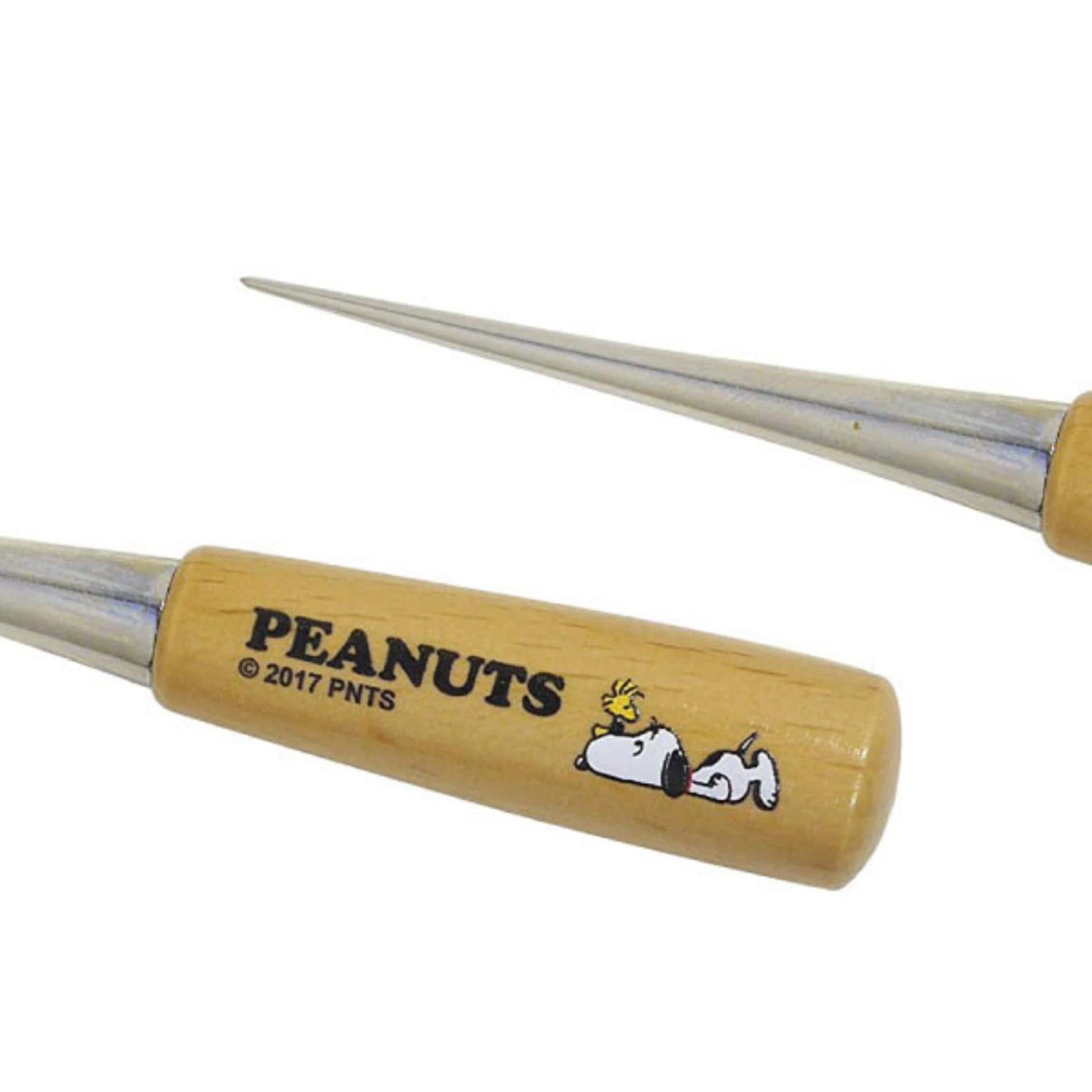 a pair of wooden handles with the text "PEANUTS © 2017 PNTS" printed on them.