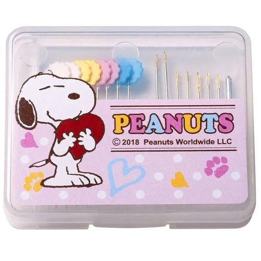 A clear plastic container with a cartoon image of a dog holding a heart and the text "Peanuts" and "© 2018 Peanuts Worldwide LLC" printed on it.